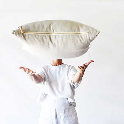 Oatmeal gray linen pillow with brass zipper, styled view